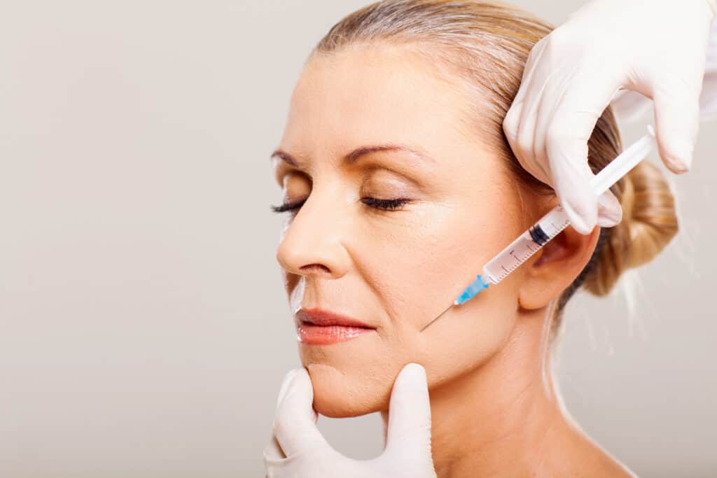 Closed Eyes Woman Getting Bio-stimulator Injection | Medbeautiq in Boca Raton, FL