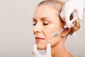 Closed Eyes Woman Getting Bio-stimulator Injection | Medbeautiq in Boca Raton, FL