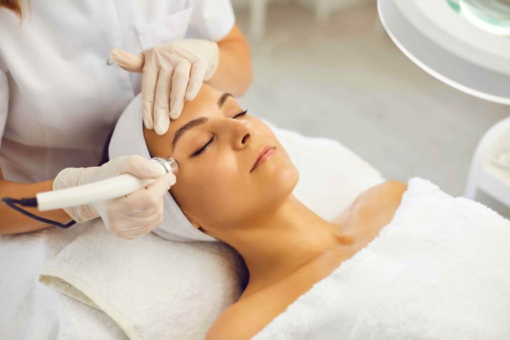 Closed Eyes Lying Woman Getting Skin Resurfacing Treatment | Medbeautiq in Boca Raton, FL